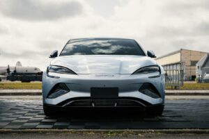 A white sports car parked on the side of the road