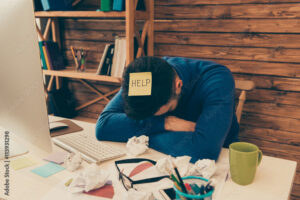 Portrait of tired man having long working day and needing help