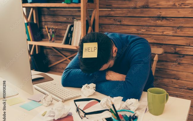 Portrait of tired man having long working day and needing help